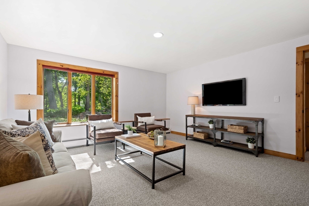 3 Whitman Place Beverly, MA 01915 - Photo 19 of 34 a living room with furniture and a flat screen tv