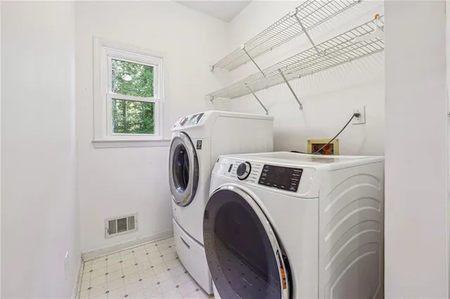 a utility room with dryer and washer