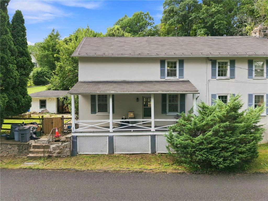 3408 Oak Hill Road Emmaus, PA 18049 - Photo 68 of 93 Classic multi-pane windows and a sheltered front porch anchor this traditional two-story exterior design.
