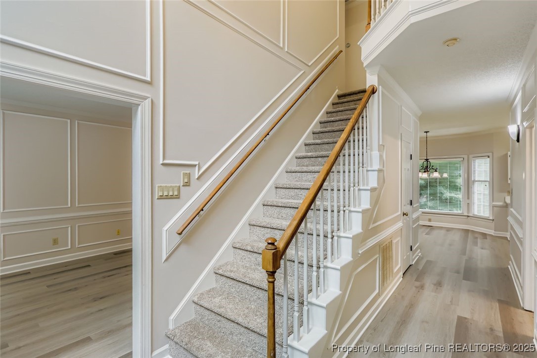 9012 Walking Stick Trail Raleigh, NC 27615 - Photo 16 of 28 a view of an entryway with wooden floor