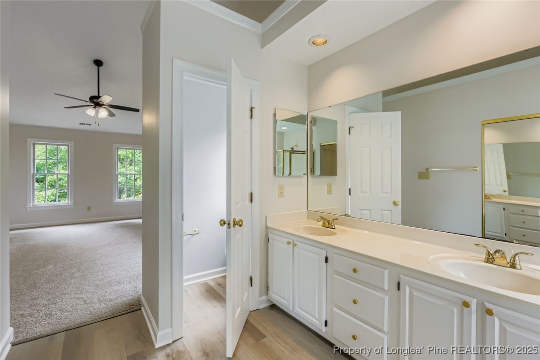 9012 Walking Stick Trail Raleigh, NC 27615 - Photo 20 of 28 a spacious bathroom with a shower sink and mirror