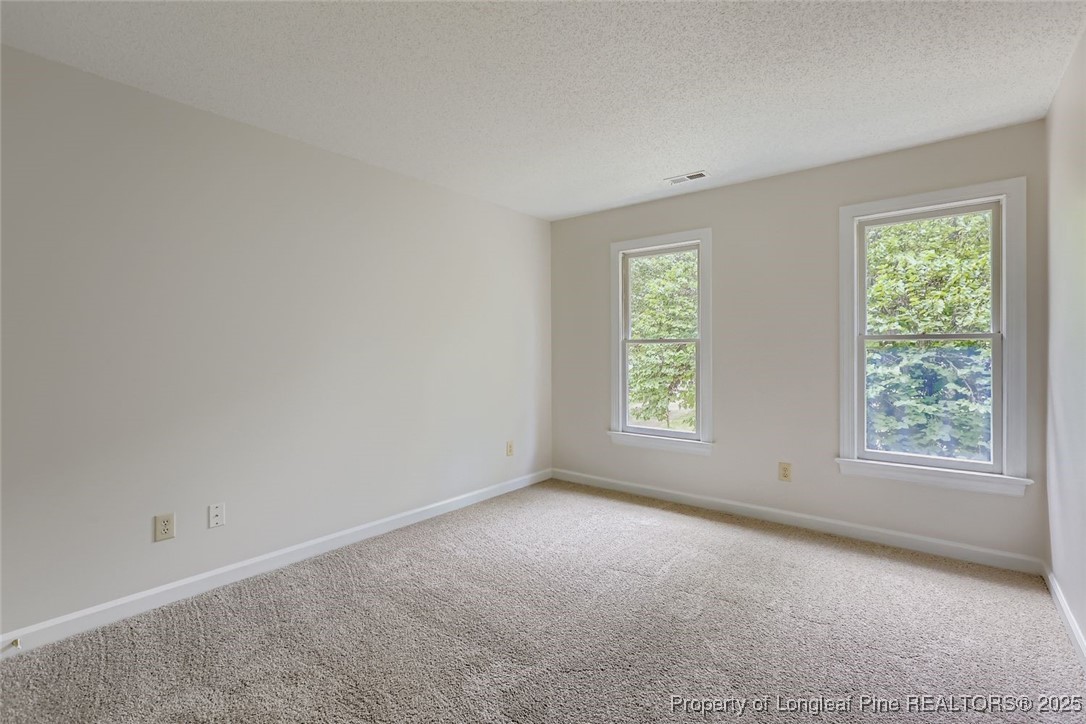 9012 Walking Stick Trail Raleigh, NC 27615 - Photo 22 of 28 an empty room with windows