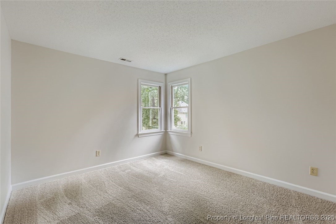 9012 Walking Stick Trail Raleigh, NC 27615 - Photo 23 of 28 an empty room with windows