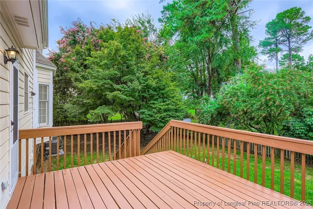 a view of balcony with wooden floor