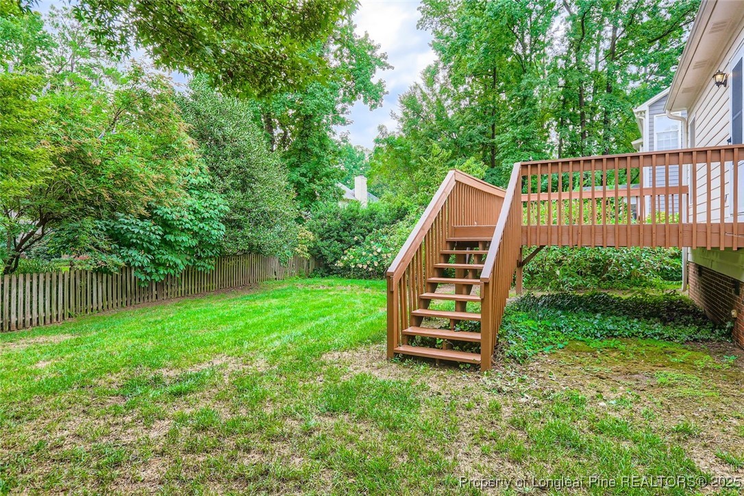 9012 Walking Stick Trail Raleigh, NC 27615 - Photo 27 of 28 a view of a backyard with a deck
