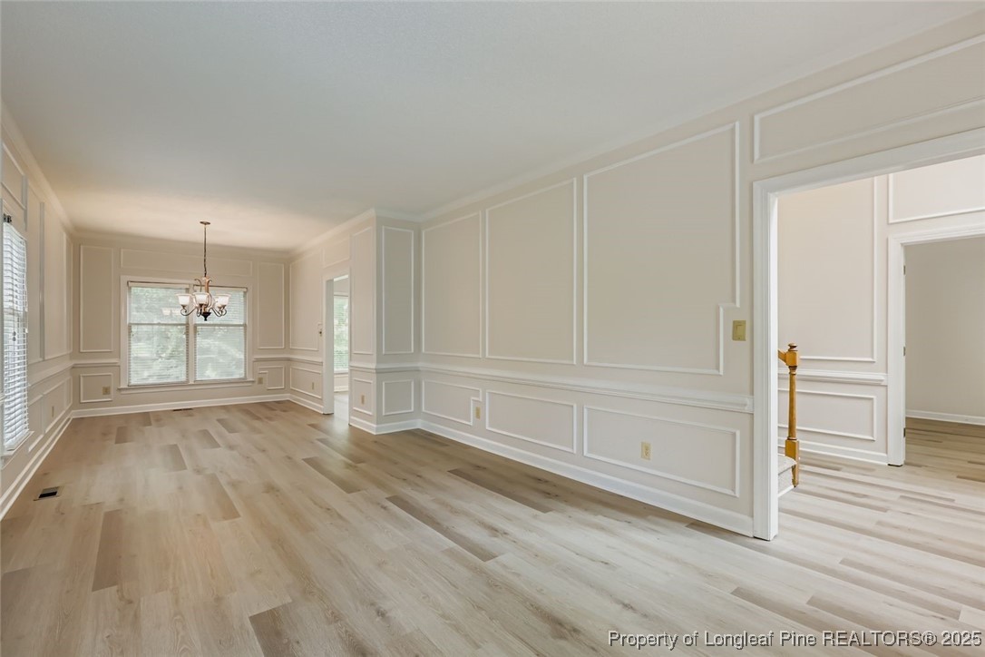 9012 Walking Stick Trail Raleigh, NC 27615 - Photo 4 of 28 wooden floor in an empty room