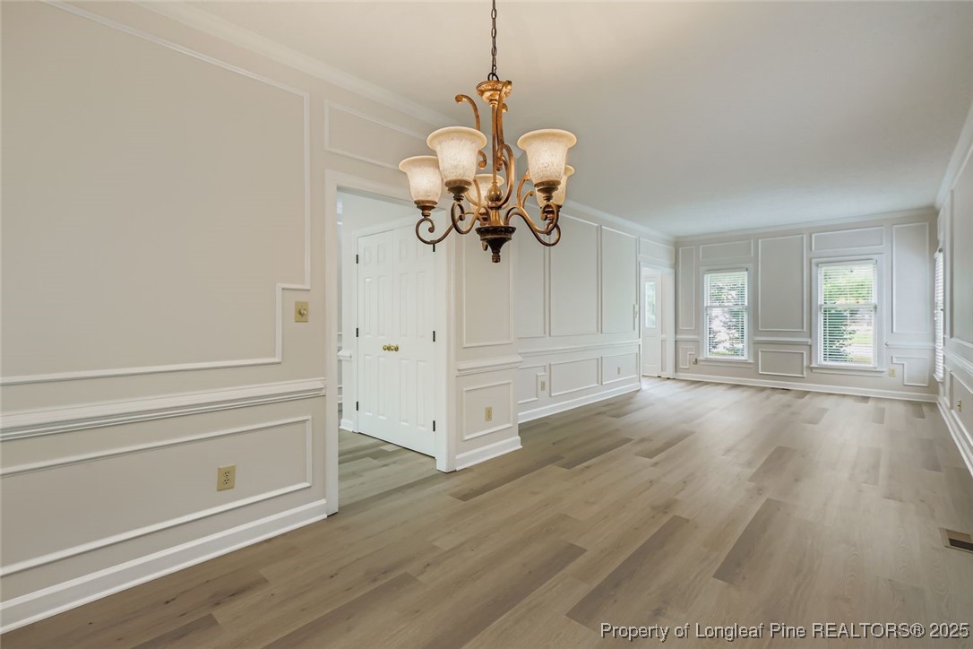 9012 Walking Stick Trail Raleigh, NC 27615 - Photo 7 of 28 a view of a livingroom with wooden floor