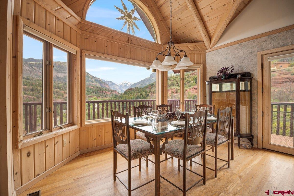 2490 County Road 17 Ridgway, CO 81432 - Photo 16 of 26 a view of a dining room with furniture window and wooden floor