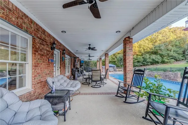 a bedroom with a bed and a flat tv screen on dresser