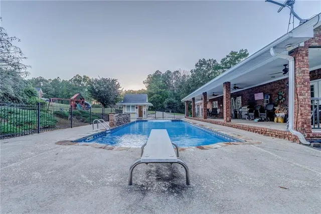 a bedroom with toys and a chandelier