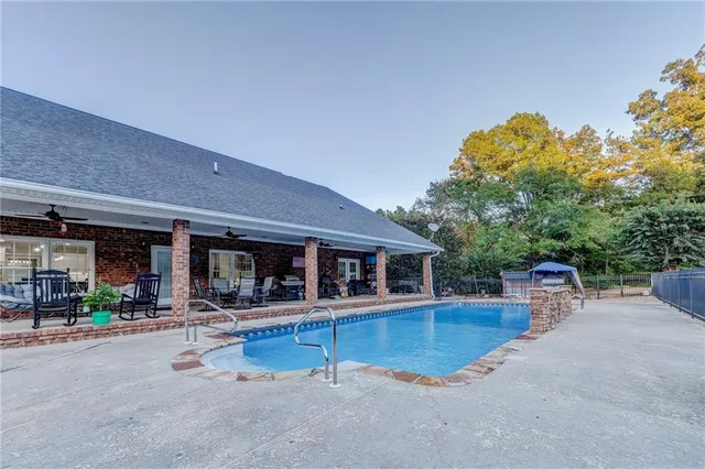 a kitchen with stainless steel appliances granite countertop a stove and a refrigerator