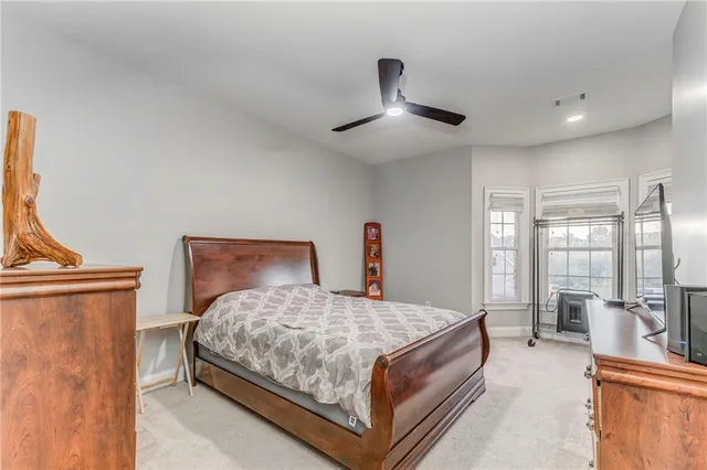 a kitchen with stainless steel appliances granite countertop a stove top oven a sink and a refrigerator