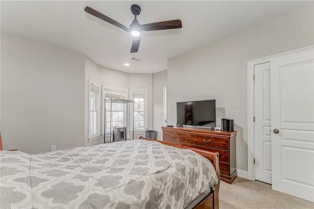 a kitchen with stainless steel appliances granite countertop a sink a stove and a wooden floors