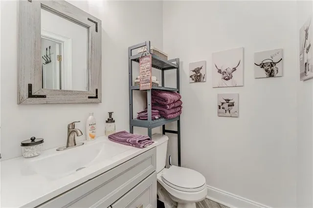 a bathroom with a sink a vanity and a mirror