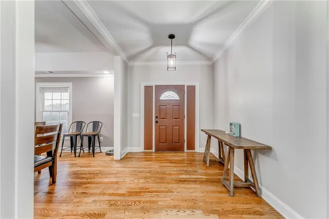 a living room with a fireplace and a flat screen tv
