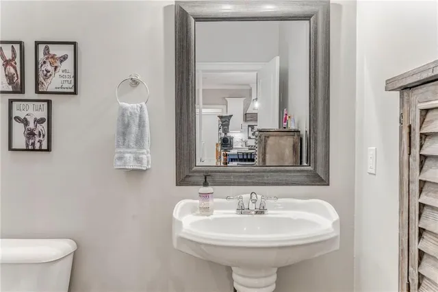 a bathroom with a sink a mirror and shower