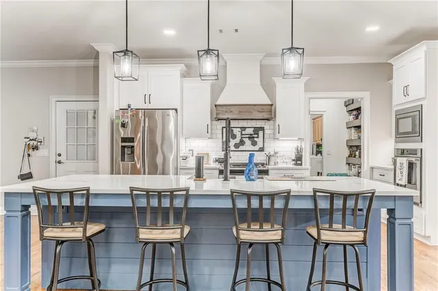 a bathroom with a double vanity sink and mirror