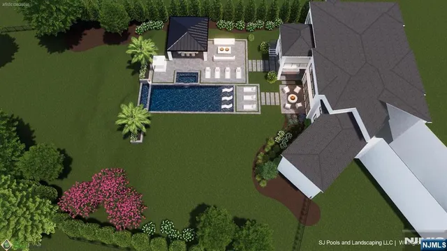 an aerial view of a house with pool garden