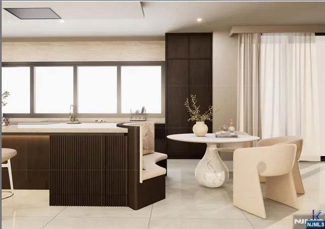 a living room with kitchen island furniture and a large window