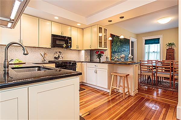 9 Fountain Road Arlington, MA 02476 - Photo 11 of 30 a kitchen with stainless steel appliances granite countertop a sink and cabinets