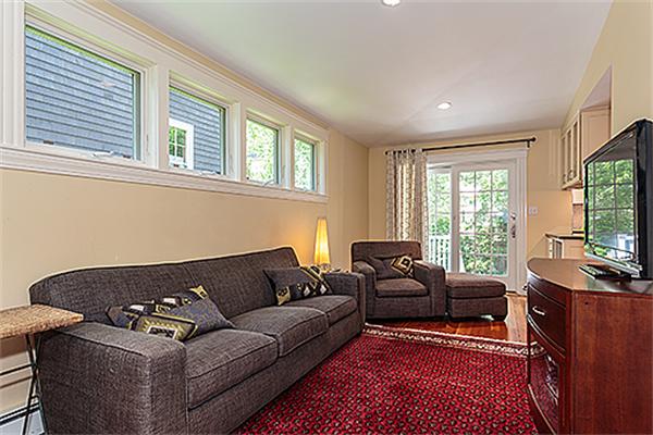 9 Fountain Road Arlington, MA 02476 - Photo 6 of 30 a living room with furniture a flat screen tv and a large window