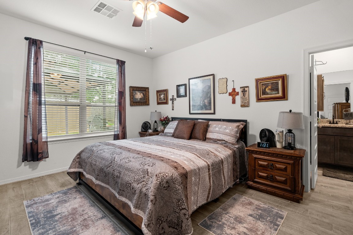 14449 Sunny Bend Way Conroe, TX 77303 - Photo 17 of 34 a bedroom with bed and a large window