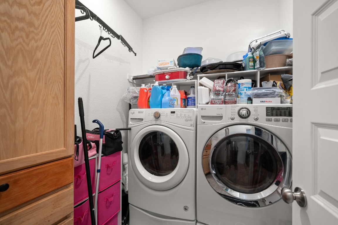 14449 Sunny Bend Way Conroe, TX 77303 - Photo 28 of 34 a utility room with dryer and washer
