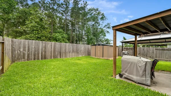 a view of yard with patio