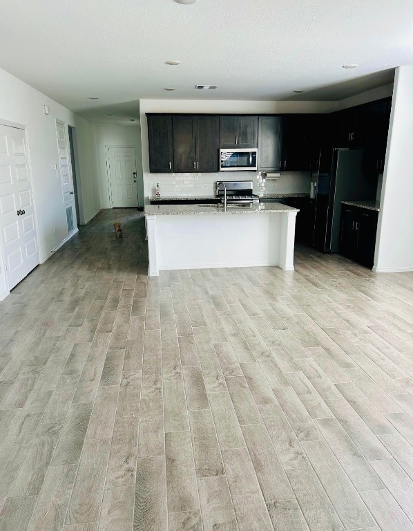 14449 Sunny Bend Way Conroe, TX 77303 - Photo 9 of 34 a view of kitchen with a sink microwave and cabinets