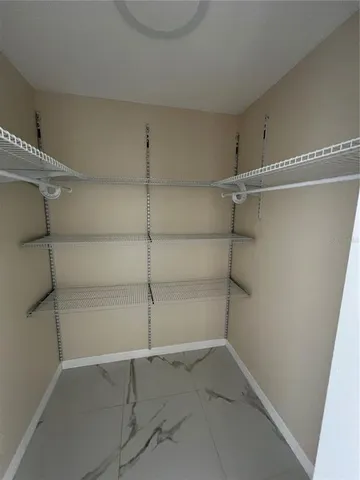 a view of a room with racks on the wall