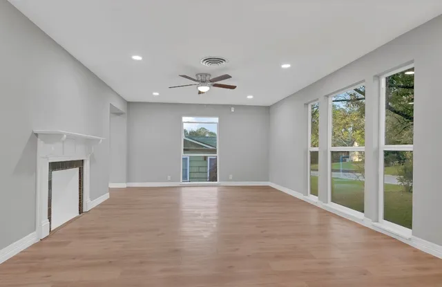 a view of an empty room with a window