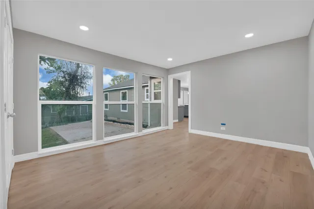 a view of an empty room with a sliding door