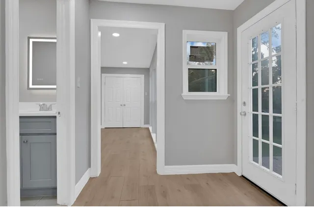 a front view of a house with a garden