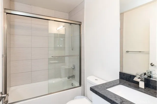 a bathroom with a bathtub and shower