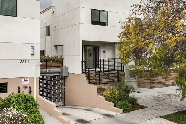 a front view of a house with large windows