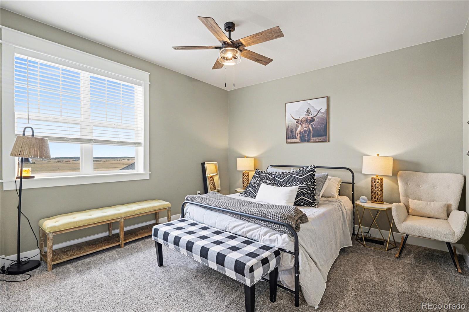 1065 Rising Sun Avenue Elizabeth, CO 80107 - Photo 13 of 37 a bedroom with furniture and a large window