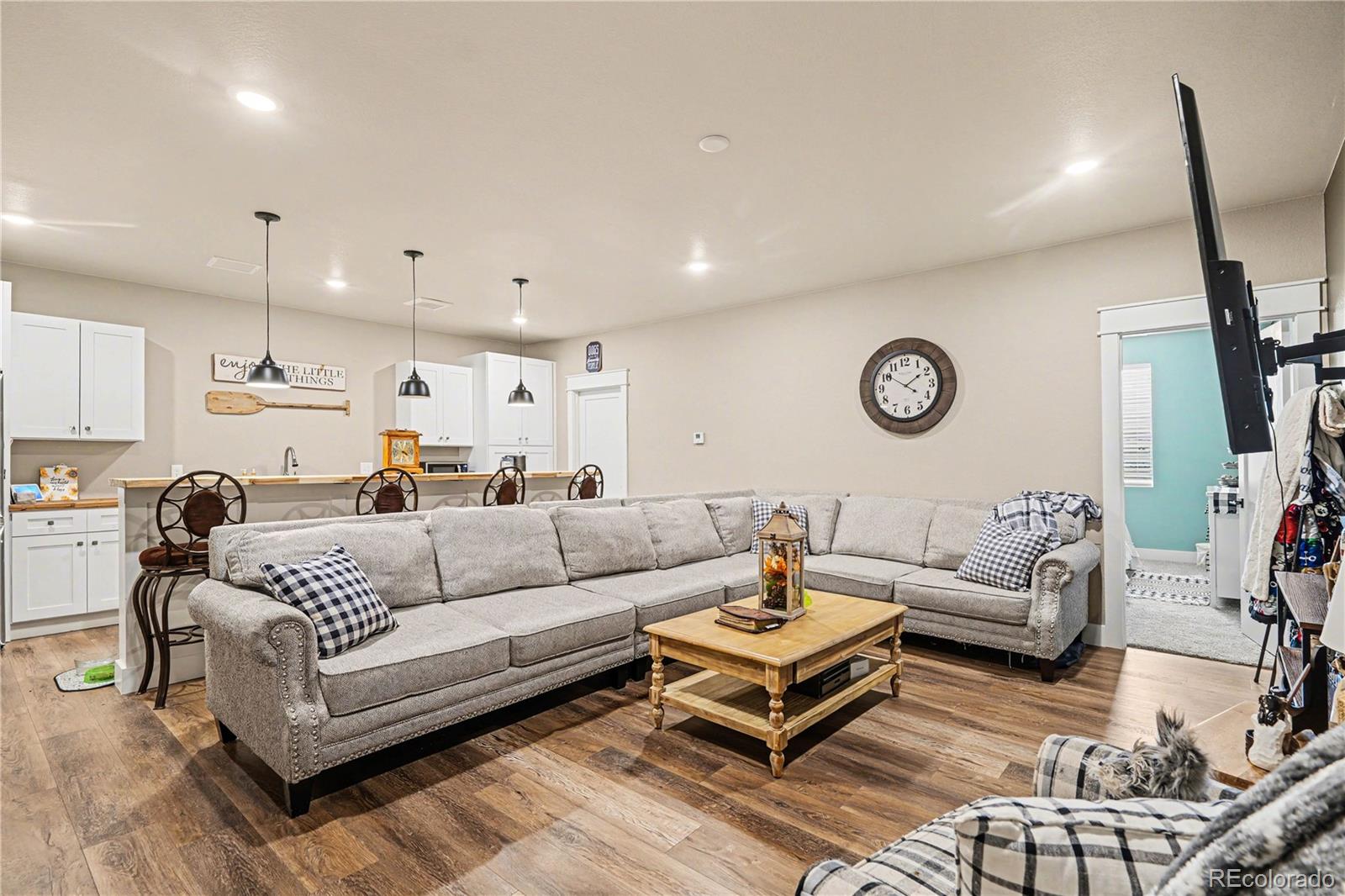 1065 Rising Sun Avenue Elizabeth, CO 80107 - Photo 15 of 37 a living room with furniture a rug and a window