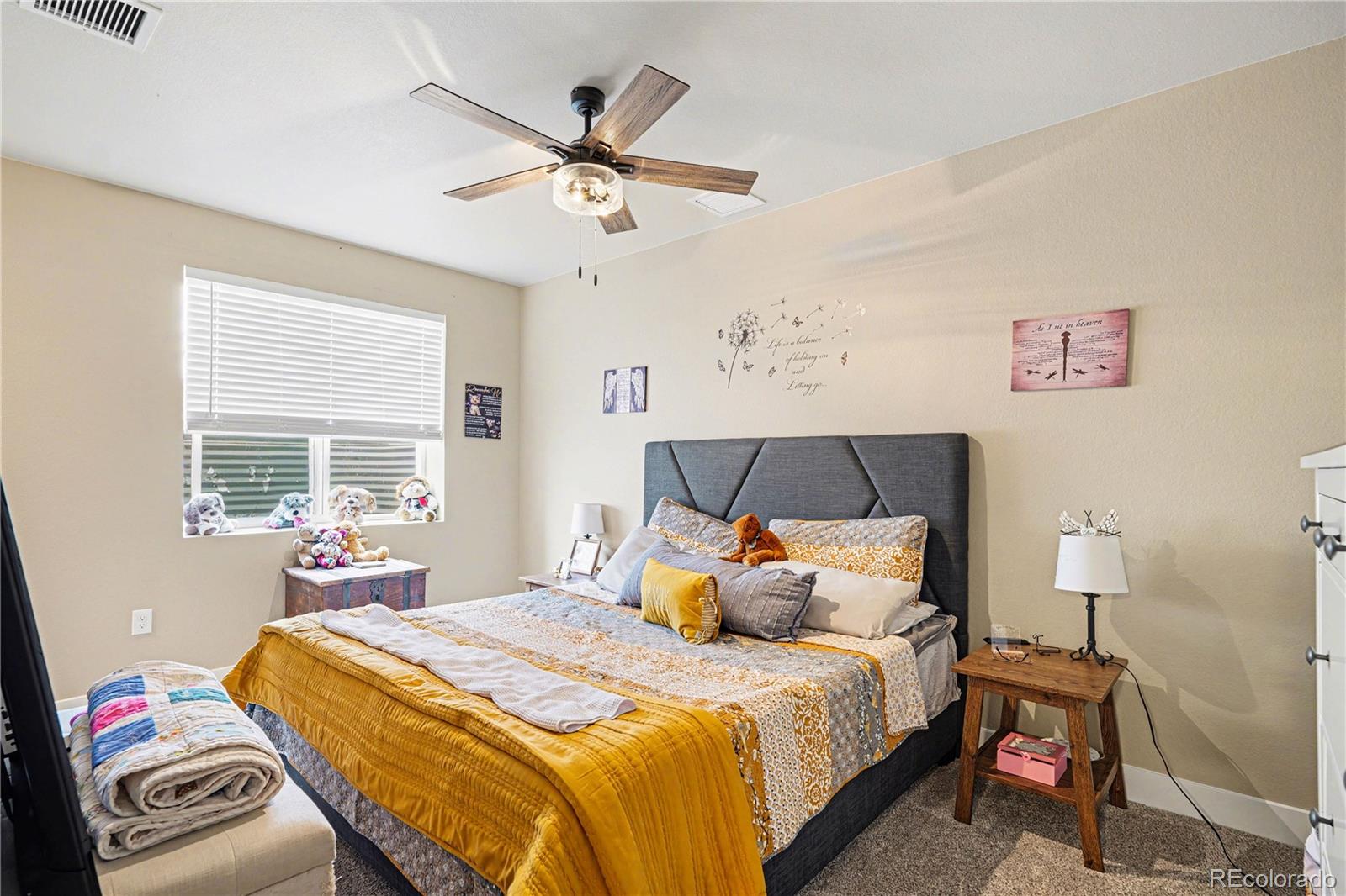 1065 Rising Sun Avenue Elizabeth, CO 80107 - Photo 19 of 37 a bedroom with a bed and window