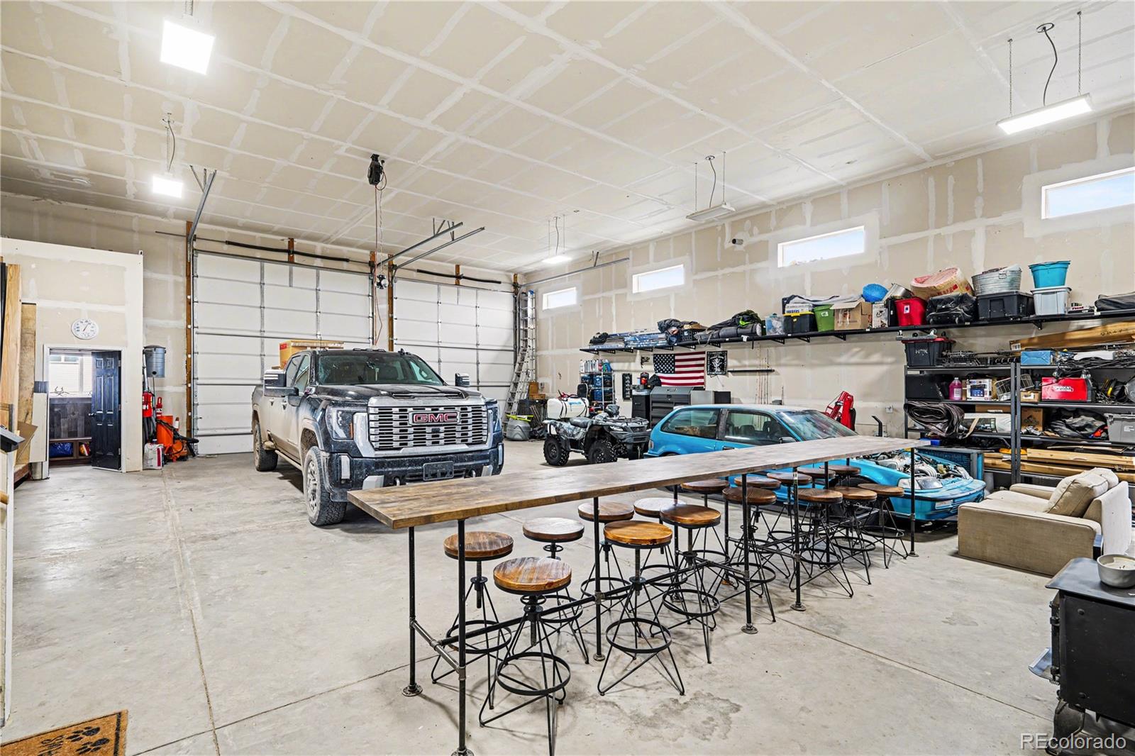 1065 Rising Sun Avenue Elizabeth, CO 80107 - Photo 29 of 37 a room with lots of furniture and white walls