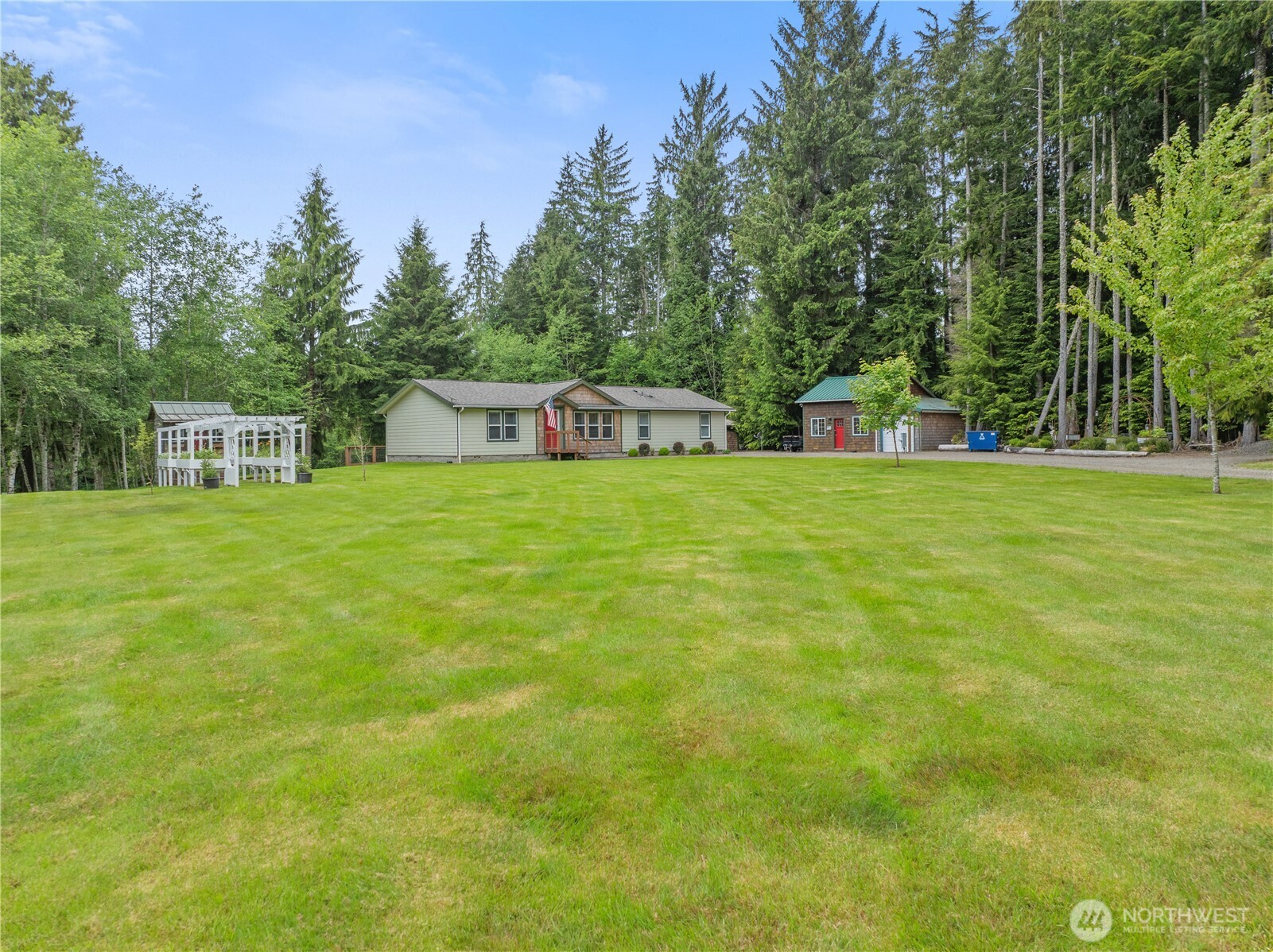 132 River Park Road Forks, WA 98331 - Photo 29 of 40 a house view with a play ground in front of it