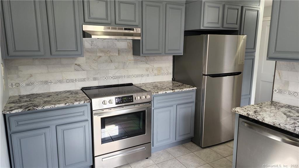 25 Madsen Road West Hartford, CT 06110 - Photo 4 of 16 a kitchen with granite countertop cabinets and steel stainless steel appliances