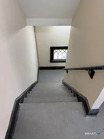 a view of a room with gym equipment and a window
