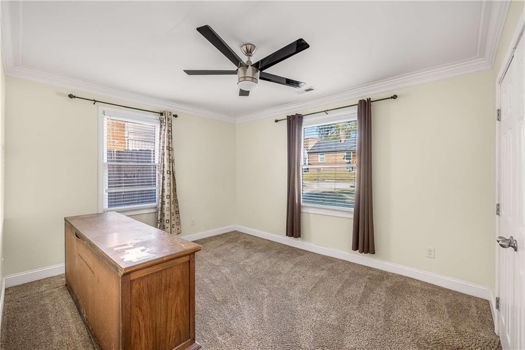 1674 Browning Street Southwest Atlanta, GA 30314 - Photo 17 of 35 a living room with a stove and a window