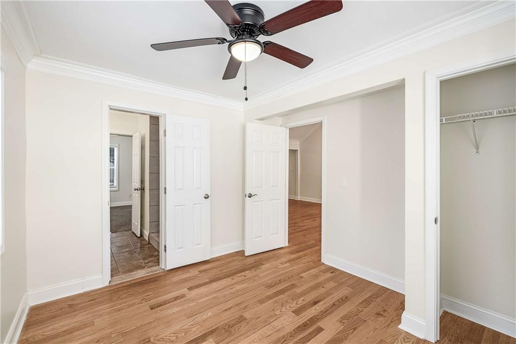 1674 Browning Street Southwest Atlanta, GA 30314 - Photo 22 of 35 a view of an empty room with wooden floor
