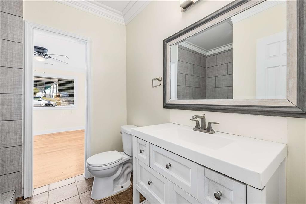 1674 Browning Street Southwest Atlanta, GA 30314 - Photo 23 of 35 a bathroom with a sink a toilet and shower