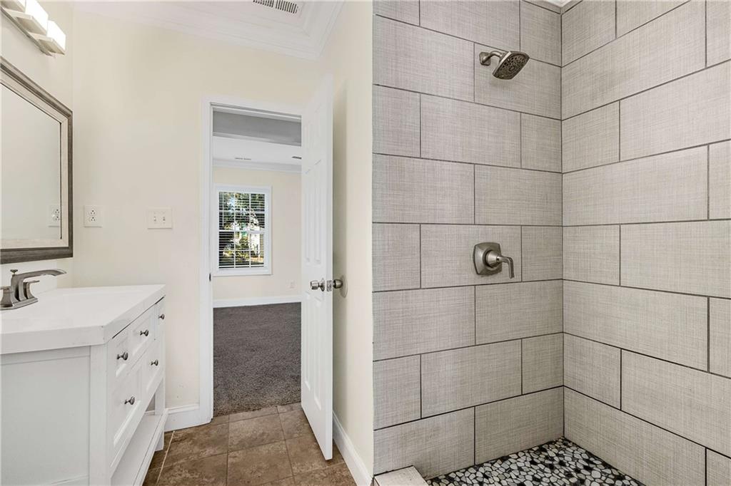 1674 Browning Street Southwest Atlanta, GA 30314 - Photo 24 of 35 a bathroom with a sink toilet and shower