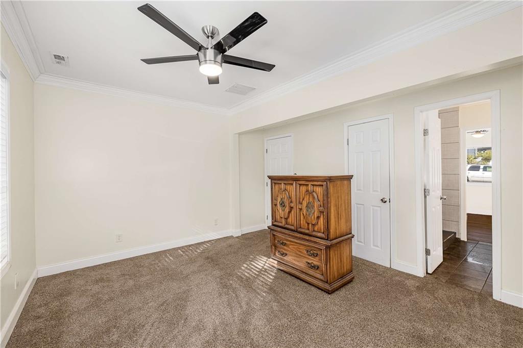 1674 Browning Street Southwest Atlanta, GA 30314 - Photo 26 of 35 a living room with a ceiling fan
