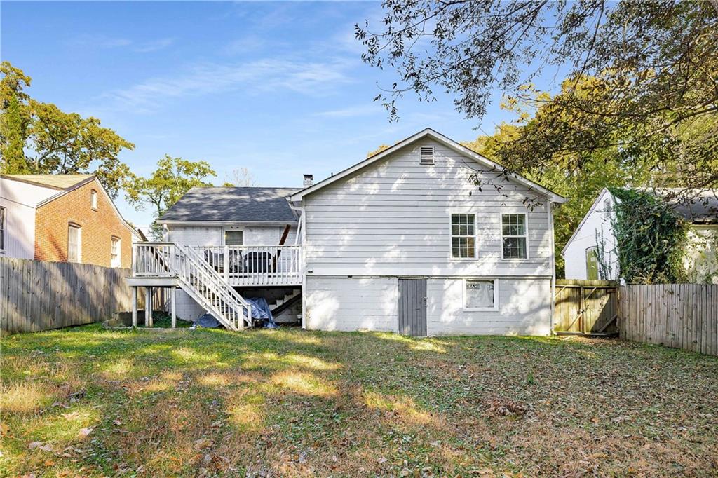 1674 Browning Street Southwest Atlanta, GA 30314 - Photo 28 of 35 a front view of a house with a yard
