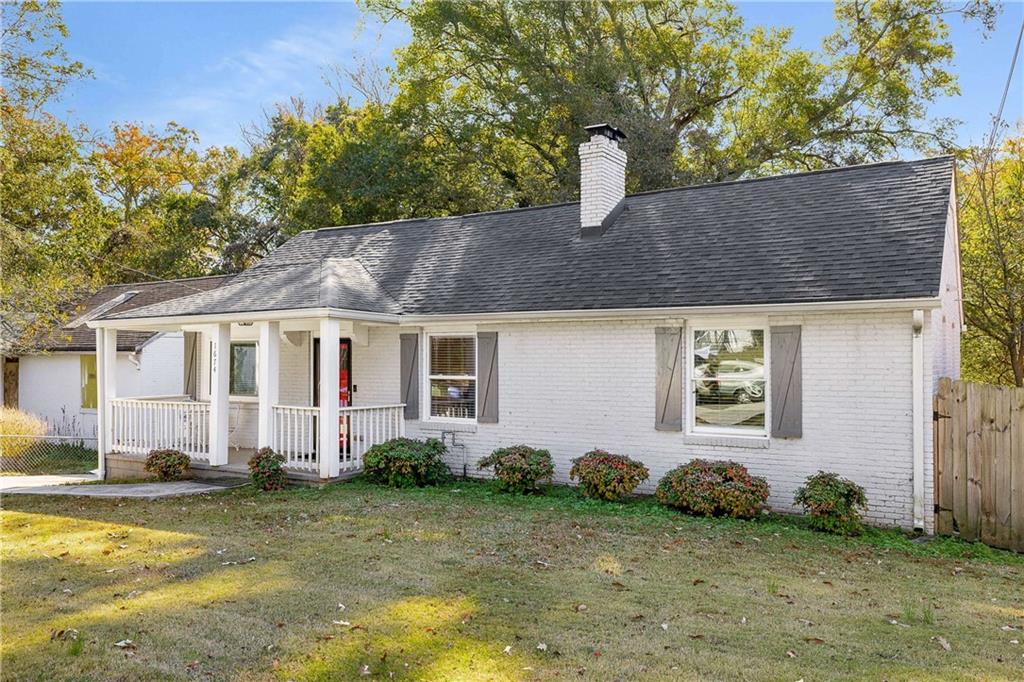 1674 Browning Street Southwest Atlanta, GA 30314 - Photo 3 of 35 a front view of a house with garden
