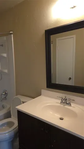 a bathroom with a sink and a toilet